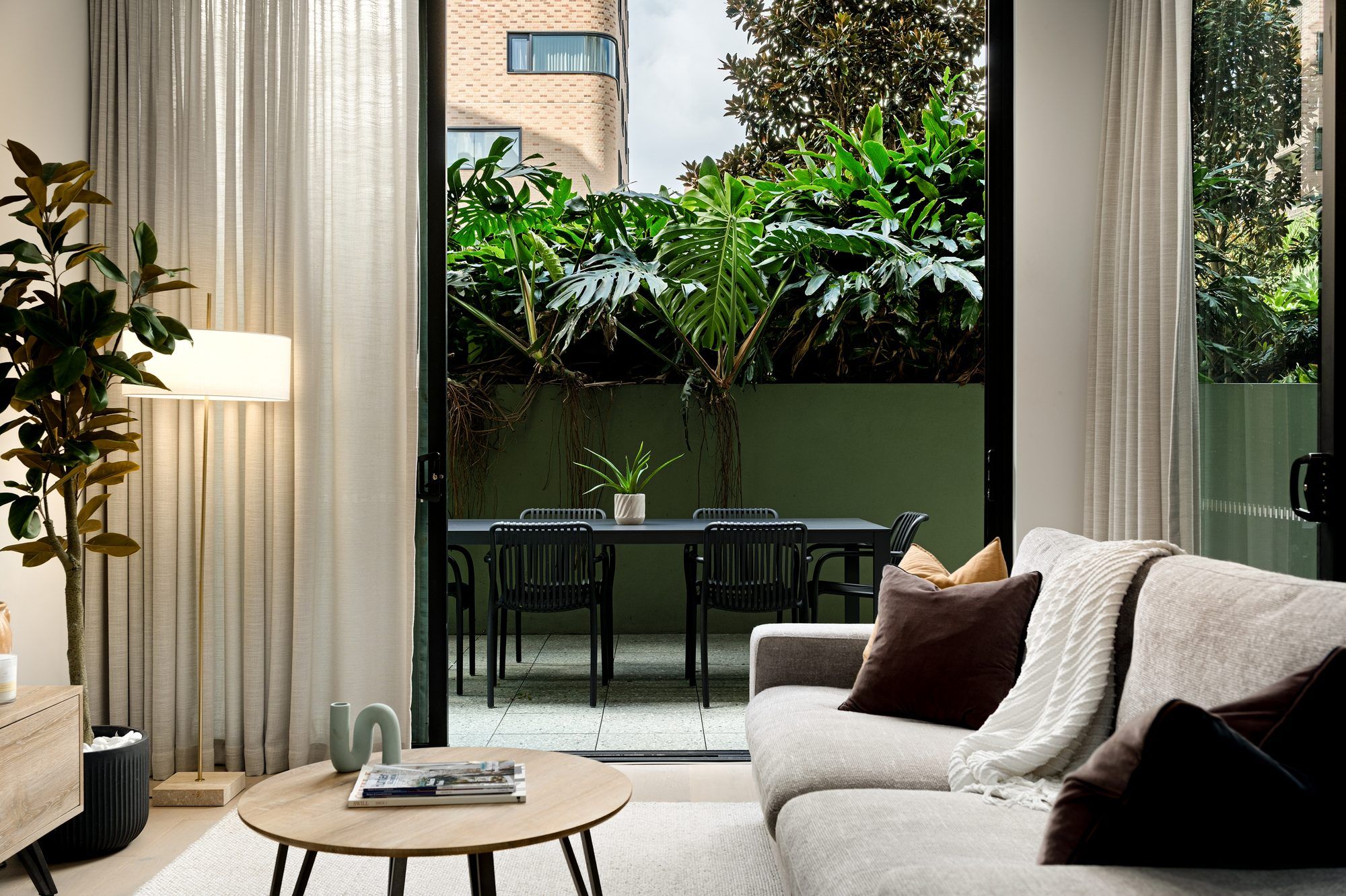 Real estate photography of apartment living room with courtyard view, Perkins Street Newcastle